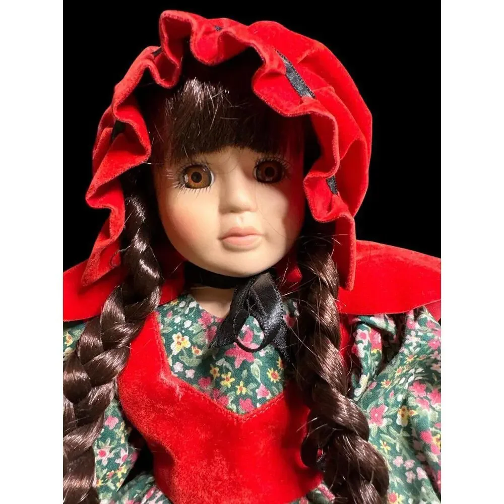 Doll 14”Little Red Riding Hood porcelain display doll in good condition with sta